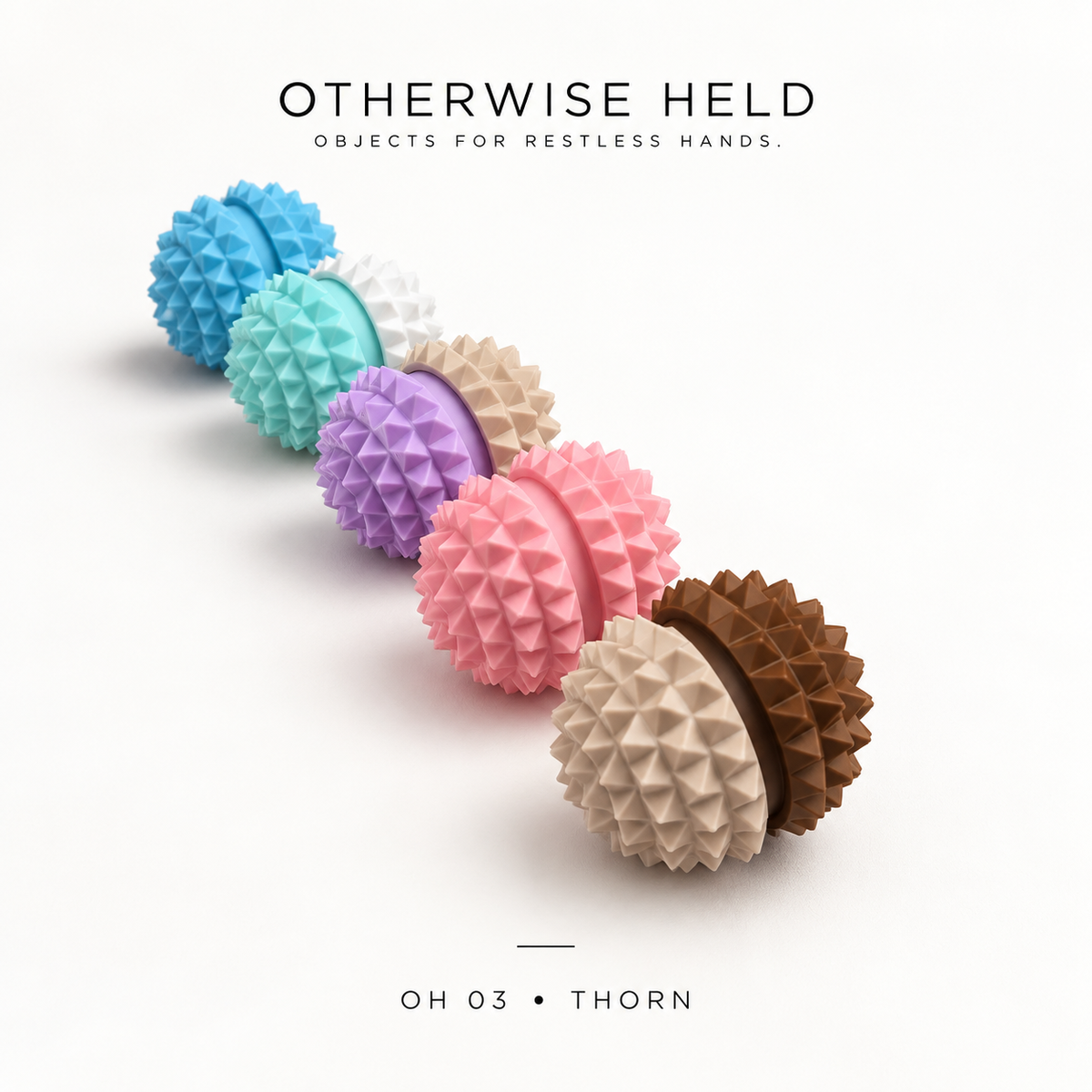 Five OH 03 Thorn spiky clickers lined up in a row