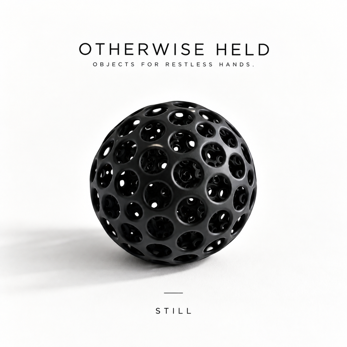 OH 02 The Hollow in Still, black rubber ball with holes