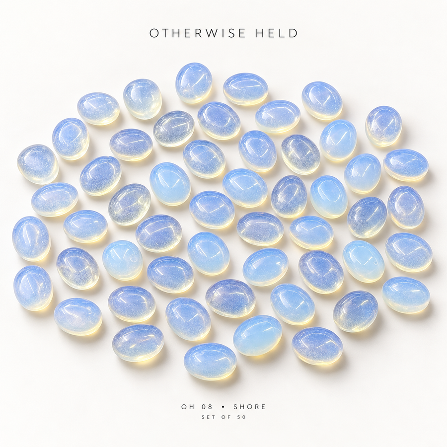 OH 08 • SHORE, a set of 50 worry stones on white