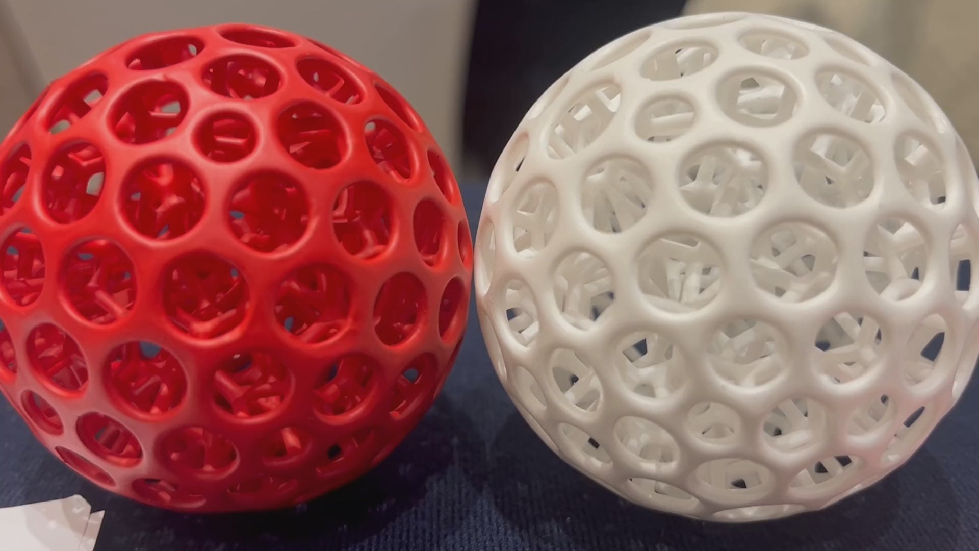 OH 02 The Hollow in red and white: side by side, squeezed in one hand, and pressed together on a table